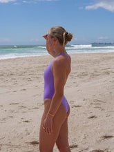 The Levanto One Piece swimsuit by JAYD Swimwear, in Lilac Haze. Side view with mid coverage.